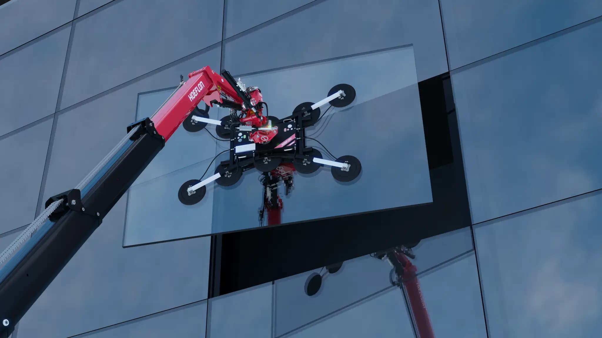 Grúa Hoeflon colocando vidrio en un edificio.