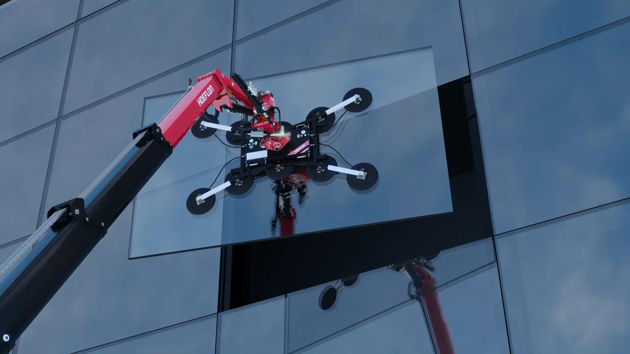 Grúa Hoeflon colocando vidrio en un edificio.