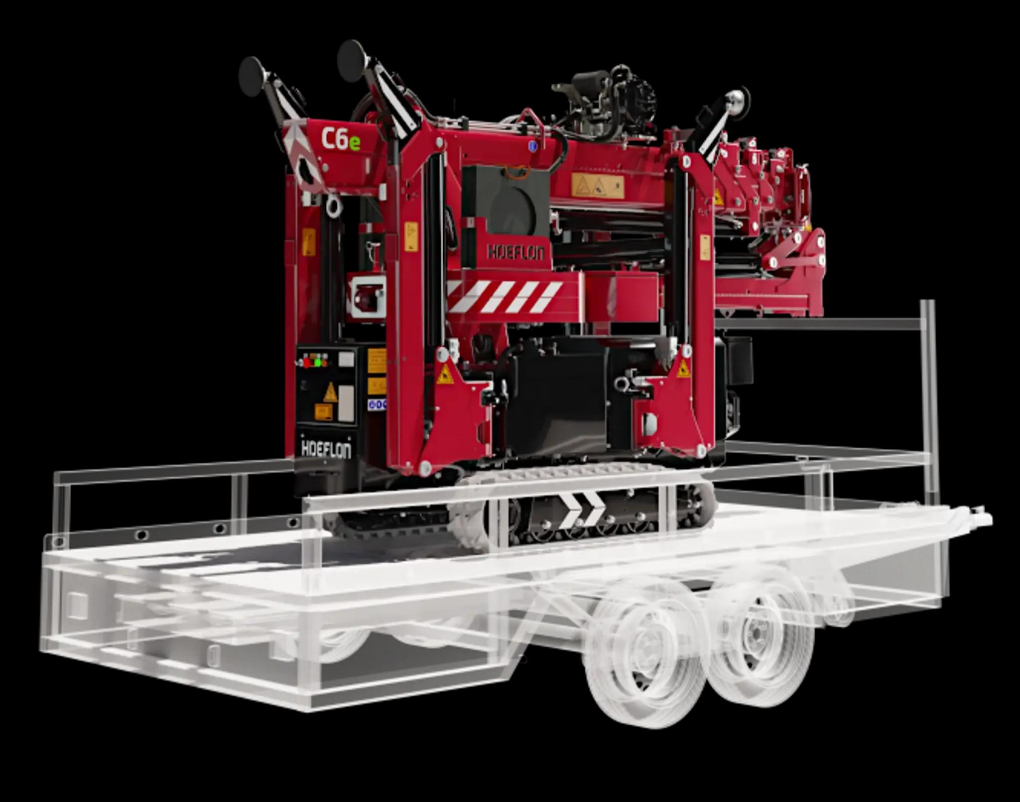 Hoeflon C6e en modo transporte en remolque compacto.
