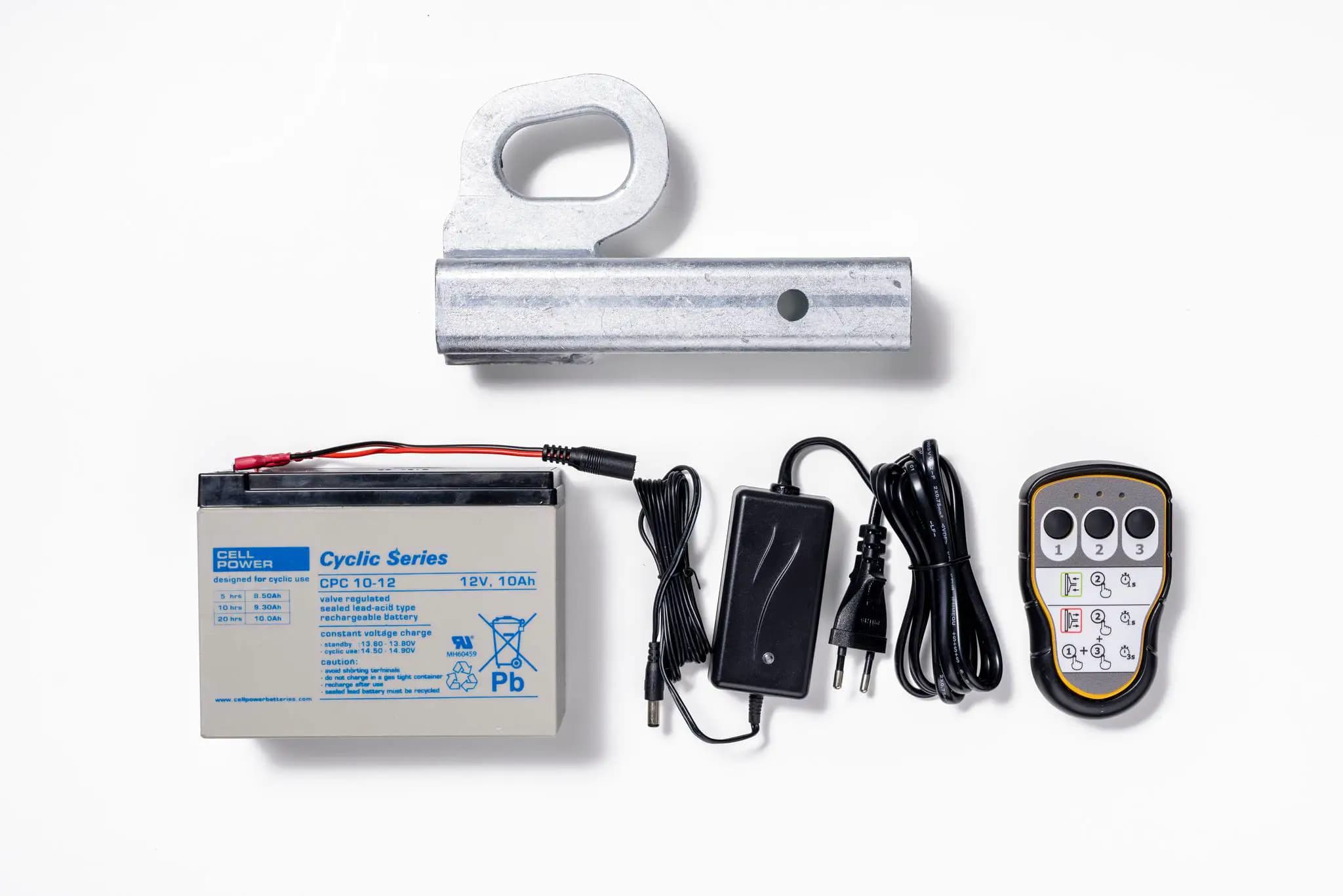 Accesorios para Hoeflon C600: batería, cables, cargador y control remoto.